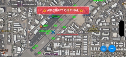 Satellite view of Scottsdale Airport with an aircraft on the runway and an "Aircraft on final" warning banner.